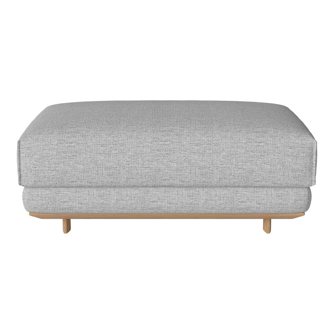 Gray upholstered ottoman with a smooth, textured pattern and light wooden legs. Simple and modern design.