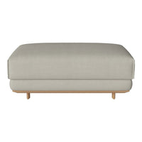 Light gray upholstered ottoman with a minimalist design and natural wood legs, perfect for any modern decor.