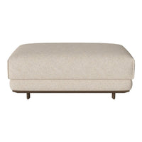 Beige upholstered ottoman with subtle texture and minimalist design, featuring a low-profile silhouette and wooden legs.