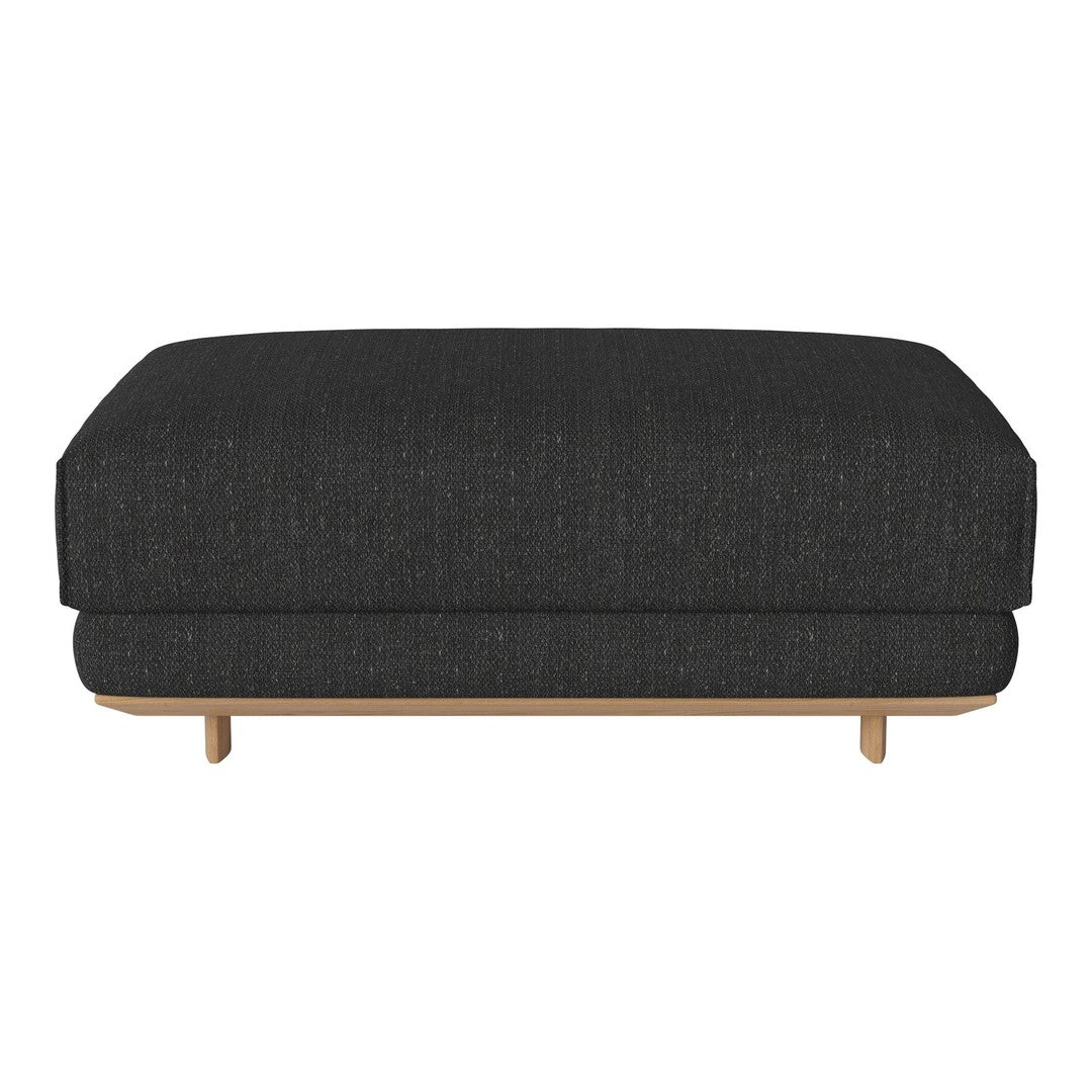 Textured dark gray ottoman with a sleek design and natural wood legs in a minimalist style. Perfect for modern interiors.