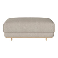 Beige upholstered ottoman with a smooth, textured pattern and wooden legs, ideal for modern interiors.