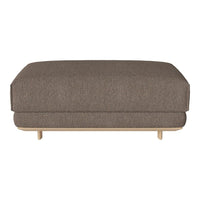 Brown fabric ottoman with a smooth, minimalist design and wooden legs. Versatile addition to any modern decor.