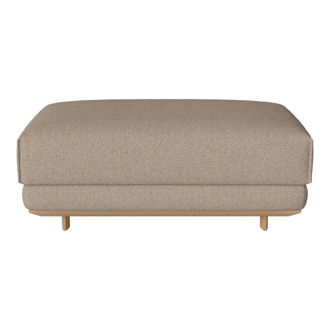 Beige fabric ottoman with a smooth, textured surface and minimalist design on natural wood legs.