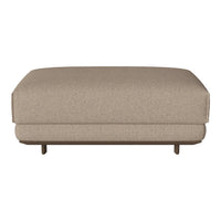 Beige textured ottoman with a smooth surface and minimalist design, featuring subtle stitching and wooden legs.