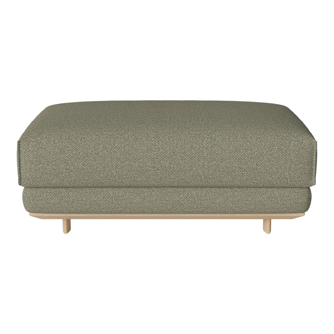 Olive green upholstered ottoman with a subtle textured pattern and light wood legs, perfect for modern decor.