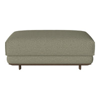Green textured ottoman with a subtle pattern and wooden legs, perfect for modern home decor.