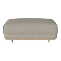 Gray upholstered ottoman with a smooth texture and minimalist design on a light wooden base.