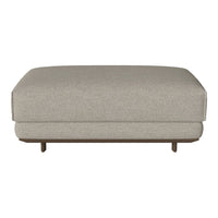 Light gray upholstered ottoman with a smooth texture and subtle pattern, featuring elegant wooden legs.