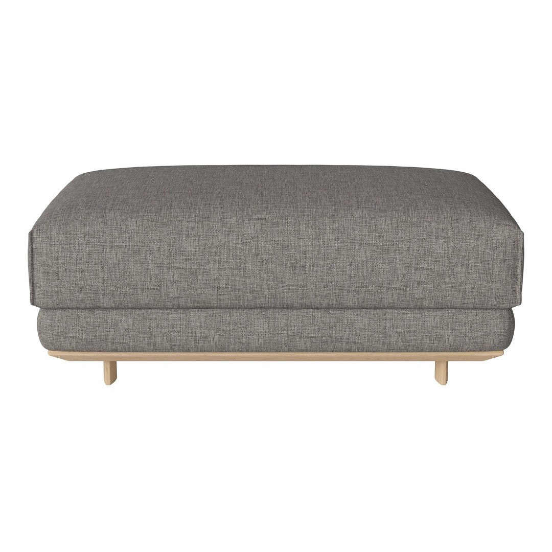 Gray upholstered ottoman with a sleek, textured pattern and wooden legs. Perfect for modern living spaces.