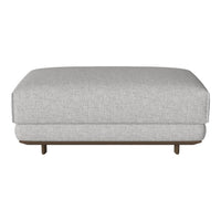 Light gray upholstered ottoman with a minimalistic design and natural wood feet. Perfect for modern decor.