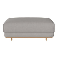 Light gray upholstered ottoman with smooth, minimalist design and natural wood legs. Perfect for modern decor.