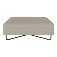 Beige upholstered ottoman with a smooth texture and black metal base. Modern minimalist design for versatile decor.