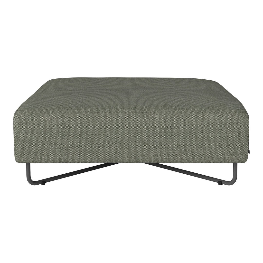 Green upholstered ottoman with a smooth texture and minimalist design on a sleek metal base.