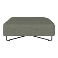 Green upholstered ottoman with a smooth texture and minimalist design on a sleek metal base.