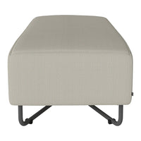 Beige textured ottoman with a minimalist design and metal legs, perfect for modern decor.