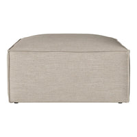 Soft beige ottoman with a textured fabric surface, featuring a minimalist design and no visible patterns.