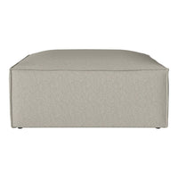 Beige square ottoman with a smooth, seamless fabric surface and subtle texture, perfect for modern decor.