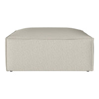 Light beige square ottoman with a textured fabric pattern and rounded edges, perfect for modern decor.