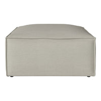 Beige rectangular ottoman with a smooth, textured fabric surface and subtle stitching details.