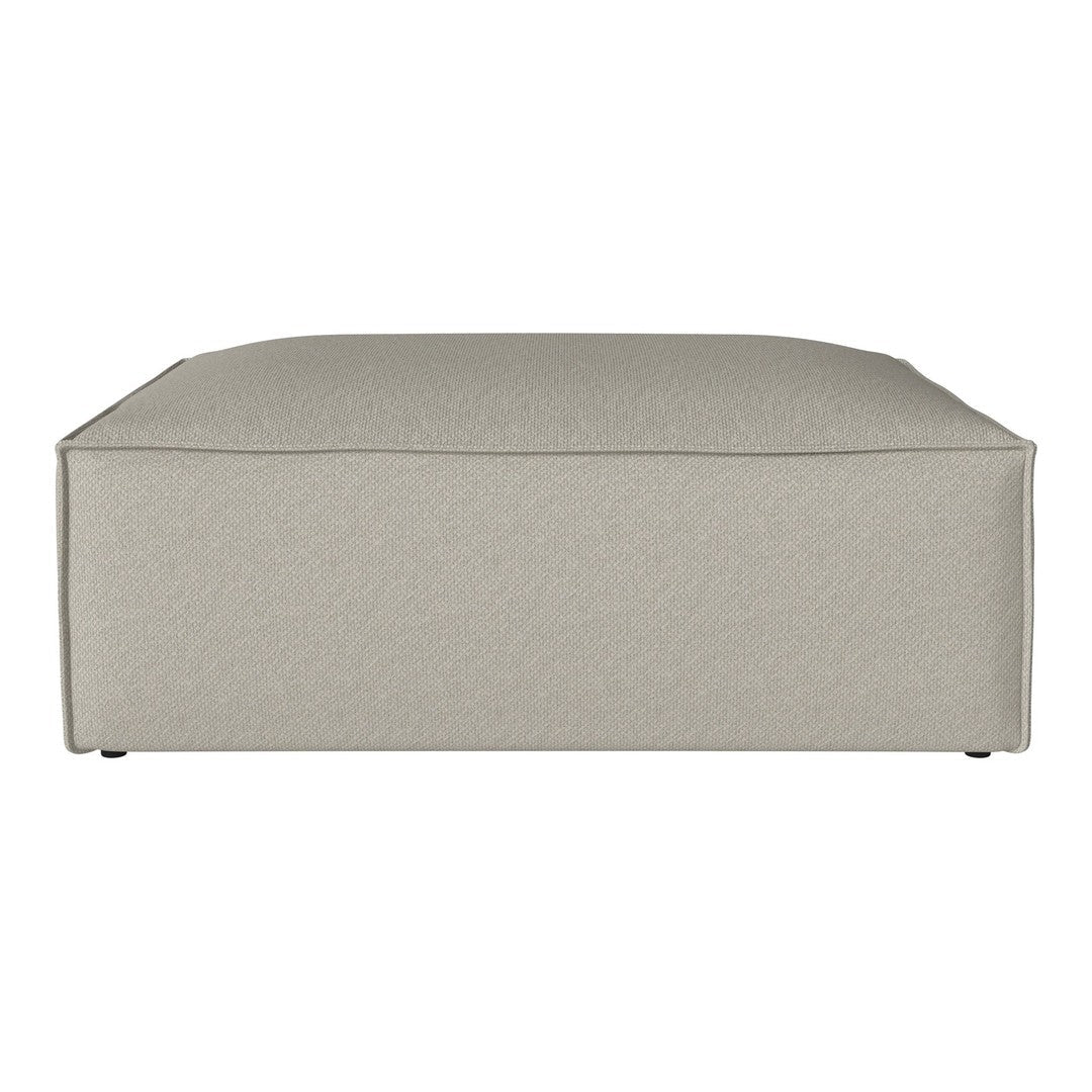 Light beige upholstered ottoman with a smooth, minimalist design and no visible patterns. Ideal for modern decor.