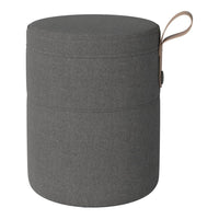 Gray fabric storage ottoman with a textured pattern and a brown handle. Stylish and functional home accessory.