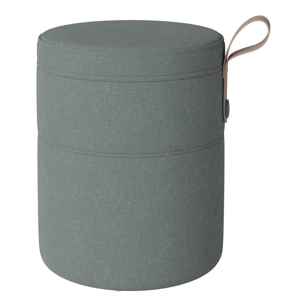 Round green storage ottoman with a textured finish and top handle for easy carrying.