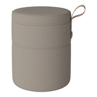 Neutral beige storage ottoman with textured pattern and a matching handle for easy transport.