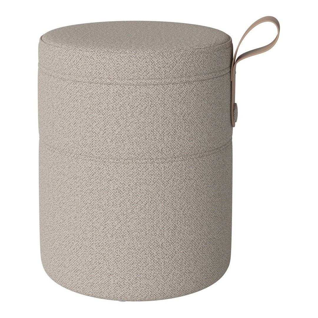 Round storage container in light beige with a textured surface and matching handle.