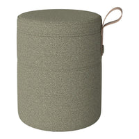 Green textured pouf with a subtle pattern and a tan leather handle. Ideal for versatile home decor.