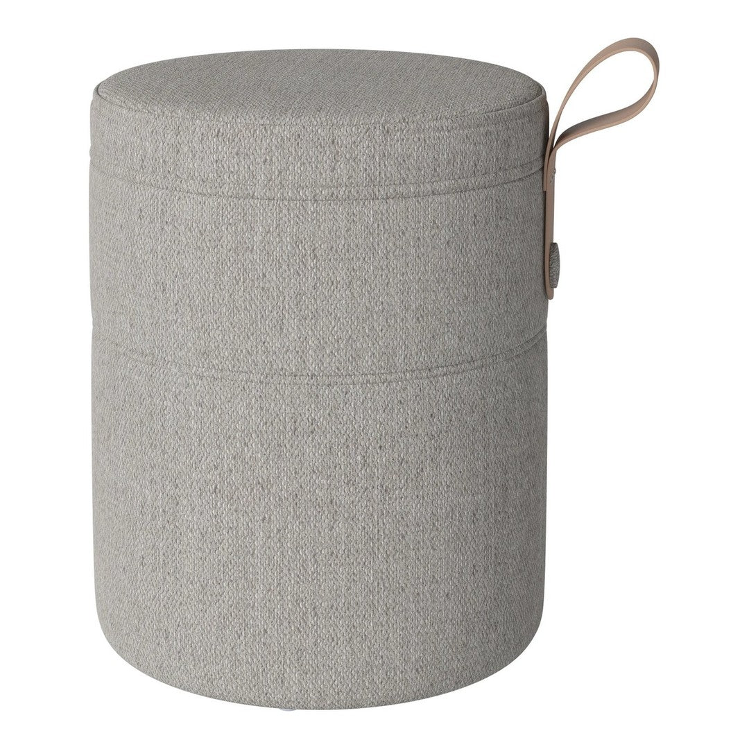 Gray textured storage ottoman with a minimalist design and a tan leather handle.