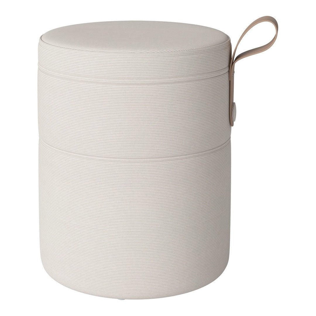 Beige cylindrical storage ottoman with a smooth finish and leather strap accent. Simple and modern design.