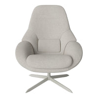 Light grey upholstered chair with a curved silhouette and minimalist design, featuring a smooth, textured fabric.