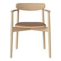 Light oak armchair with a sleek design and a warm tan seat, featuring minimalistic lines and natural wood grain.