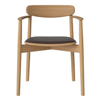 Natural wood chair with a light oak finish and a sleek black leather seat. Minimalist design, elegant curves.