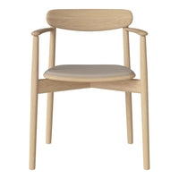 Light wood chair with a simple, natural finish and a smooth gray upholstered seat. Minimalist design and soft hues.