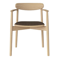 Natural wood chair with a light finish and a dark, textured seat cushion. Minimalist design, showcasing neutral tones.