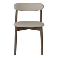 Beige upholstered chair with a minimalist design and elegant wooden legs. Perfect for modern interiors.