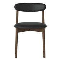 Black upholstered chair with a smooth finish and natural wood legs. Minimalistic design with a modern touch.