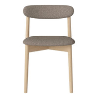 Minimalist beige chair with soft, textured upholstery and smooth light wooden legs.