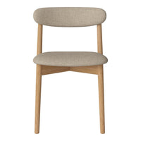 Tan upholstered chair with soft, textured fabric and light wooden legs in a simple, modern design.