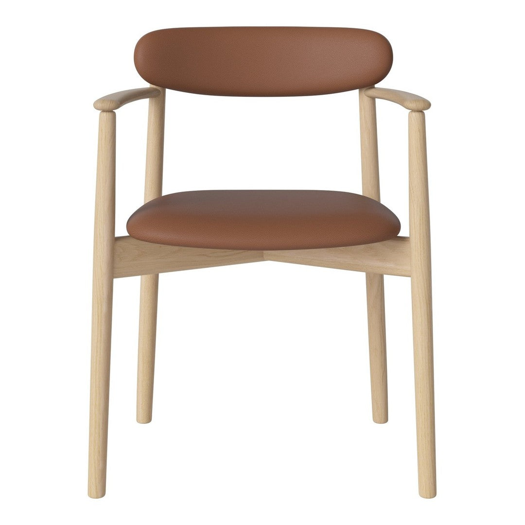 Light wooden chair with a smooth, tan leather seat and backrest, featuring a minimalist design.