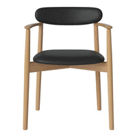 Black leather chair with natural wood frame and smooth, minimalist design. Perfect for modern interiors.