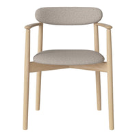 Light beige upholstered chair with a soft textured pattern and natural wood frame. Modern and minimalist design.