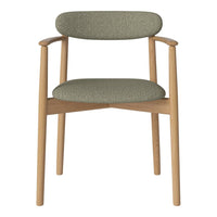 Green patterned upholstery chair with natural wood frame, perfect for modern interiors.