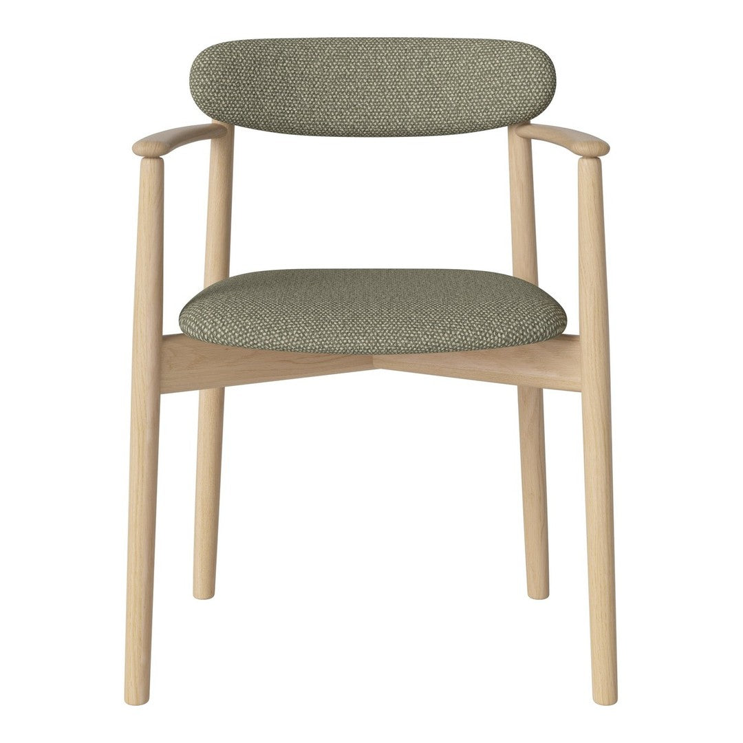 Modern chair featuring a soft green upholstery with textured patterns and natural wood legs.
