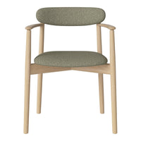 Modern chair featuring a soft green upholstery with textured patterns and natural wood legs.