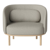 Gray fabric armchair with rounded backrest and wooden legs, featuring a minimalist and contemporary design.