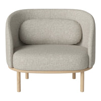 Light gray upholstered chair with a minimalist design and natural wood legs, featuring soft, curved lines.