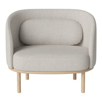 Light gray upholstered chair with smooth, curved lines and a natural wooden base. Minimalist and modern design.