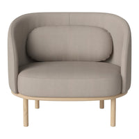 Curved beige fabric chair with a rounded backrest and light wood legs, showcasing a minimalist and modern design.